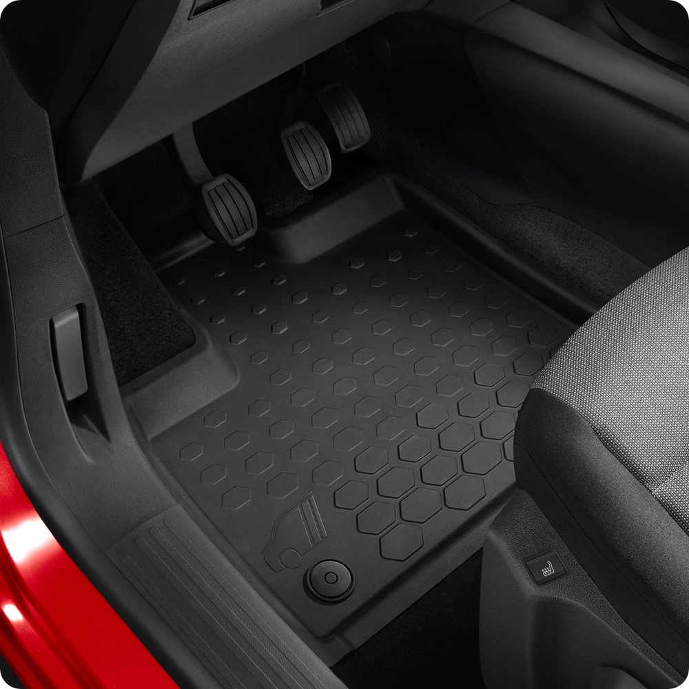 Interior view of a Citroën vehicle footwell, highlighting needle-pile front and rear floor mats.