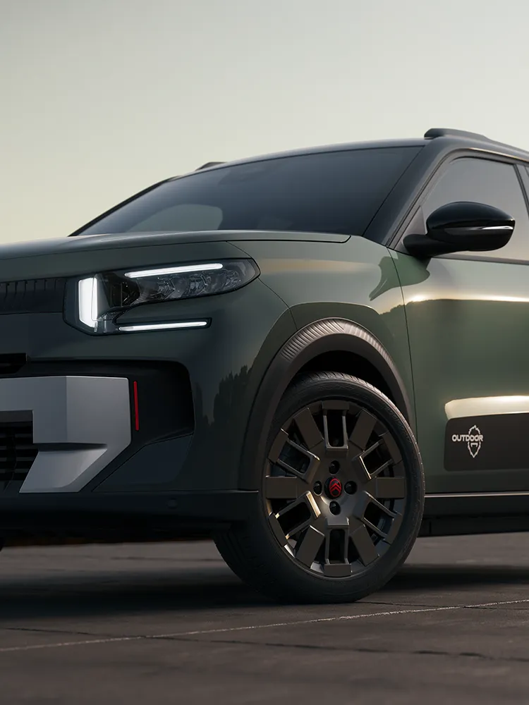 Nahaufnahme der Front des Citroën C3 Outdoor mit Leichtmetallrad und LED-Lichtsignatur zeigt den kompakten SUV mit Advanced Comfort