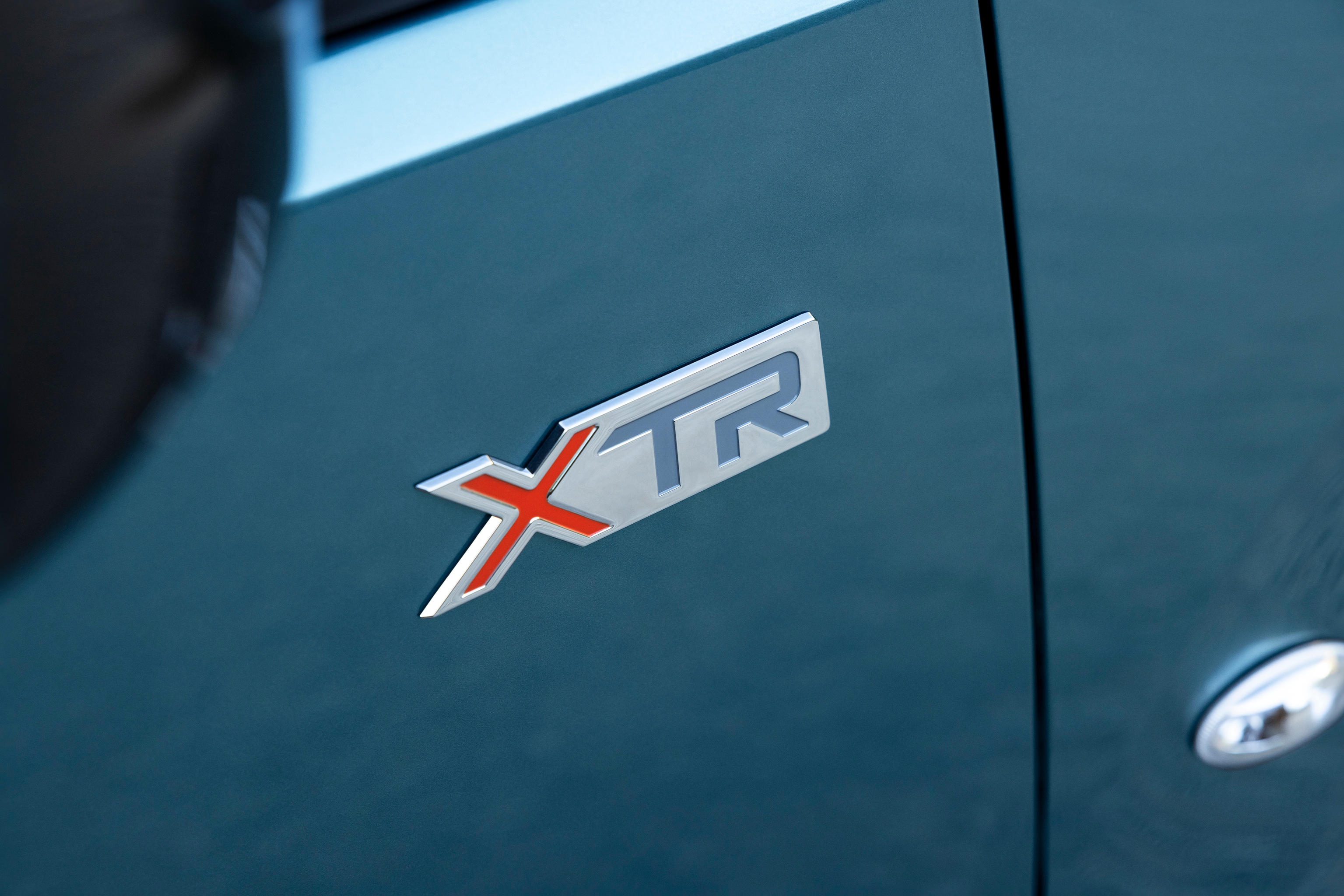 Detailansicht Berlingo XTR-Abzeichen zeigt markantes Design, Qualität, Langlebigkeit und verbesserte Modellidentität